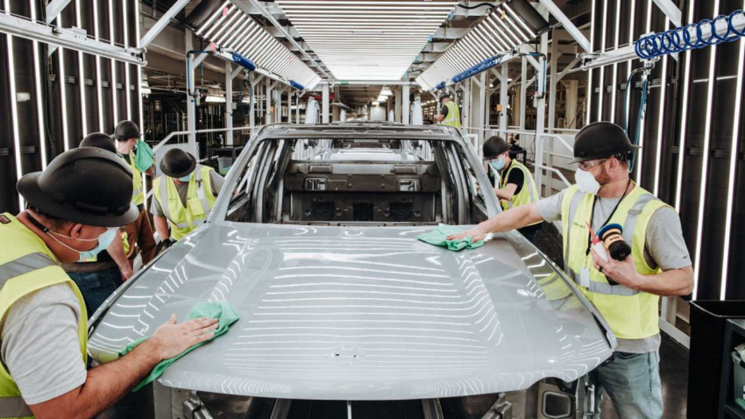 autos, cars, evs, rivian, amazon, report: rivian boosts production towards 200 units per week