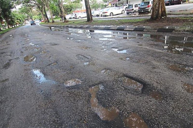 autos, cars, traffic, rains unleash pothole mayhem in klang valley