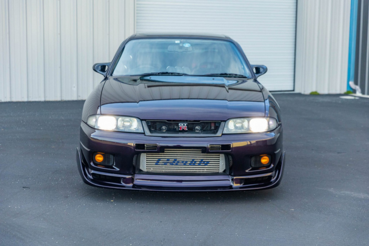 autos, cars, news, nissan, auction, nissan skyline, nissan videos, tuning, used cars, video, time to find out how much this midnight purple nissan r33 skyline gt-r v-spec is worth