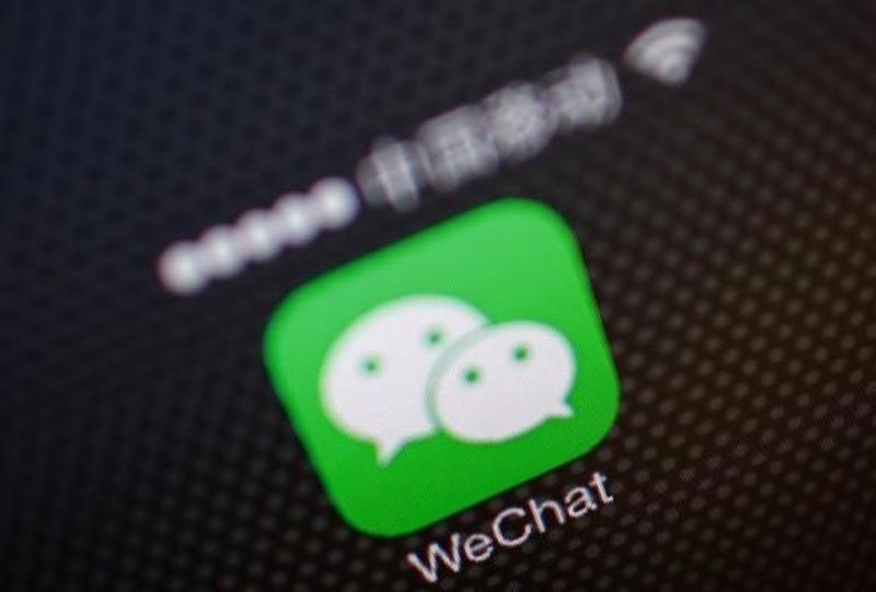 autos, cars, ford, tencent holdings ltd, wechat, ford guns for china's app addicts, seeks wechat tie-up