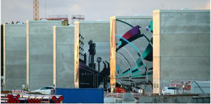 autos, cars, news, space, spacex, tesla, tesla giga berlin welcomes new graffiti art as battery cell building takes form