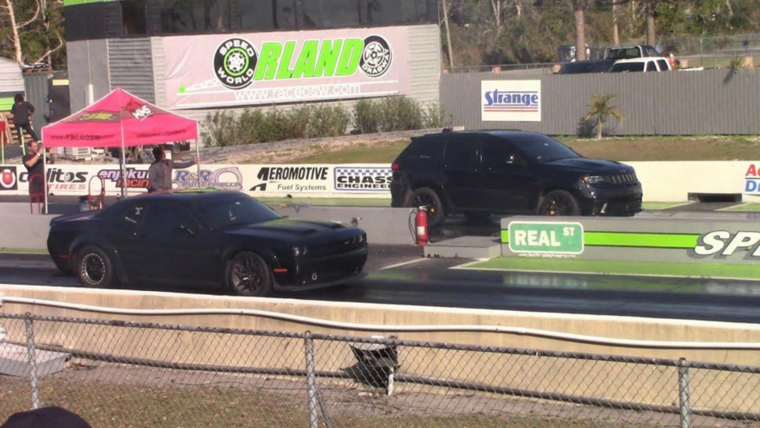 autos, cars, dodge, jeep, jeep trackhawk drag races dodge challenger in a battle of the hellcats