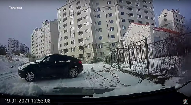 autos, bmw, cars, car news, highway code, dashcam footage shows quick-thinking russian driver reversing as oncoming bmw loses control and slides towards him