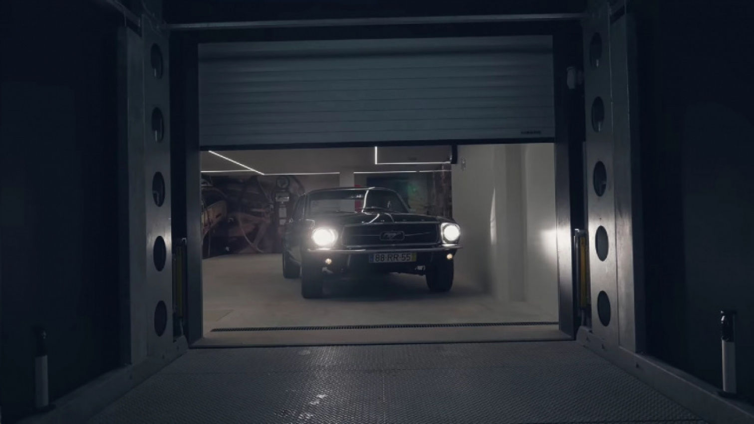 autos, cars, news, offbeat news, tech, video, this hidden lift door turns your garage into a secret lair