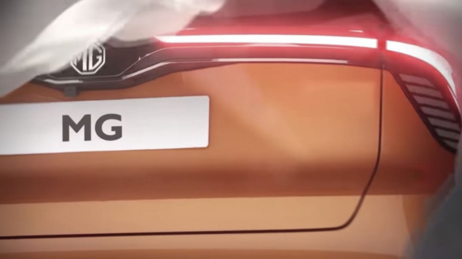 autos, cars, mg, 2023 mg 4 electric hatchback teased, reveal due this year
