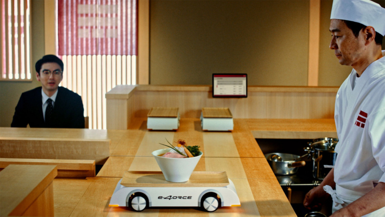 autos, cars, news, nissan, ram, electric vehicles, nissan ariya, nissan videos, video, nissan uses ariya’s e-4orce technology to deliver ramen bowls without spills