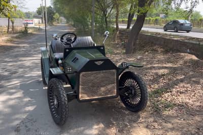 article, autos, cars, if you thought this was a vintage car think again. it is an ev made up of an enfield bike and an alto