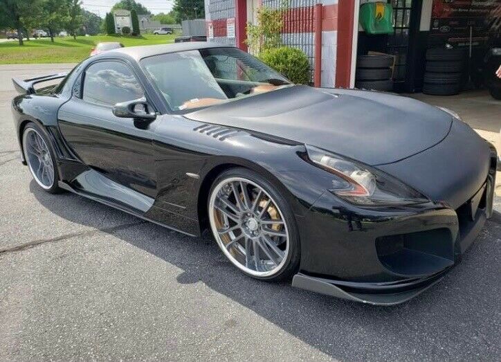 autos, cars, mazda, news, nissan, auction, ebay, mazda rx-7, mazda videos, nissan 370z, tuning, used cars, video, would you drive a mazda rx-7 with nissan 370z headlights?