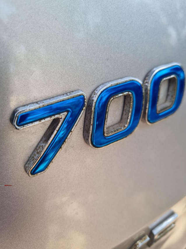 autos, cars, mahindra, indian, issues, member content, xuv700, rust on 3-month-old mahindra xuv700 logo & badges