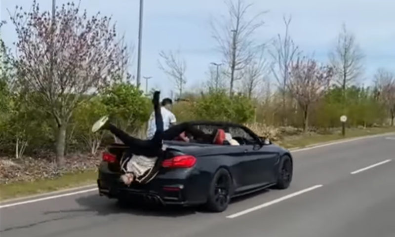 autos, bmw, cars, videos, accident, blooper, bmw m4, bmw m4 convertible, ego bruised, england, funny, uk, video, watch: bmw m4 convertible passenger accidentally backflips out of rear
