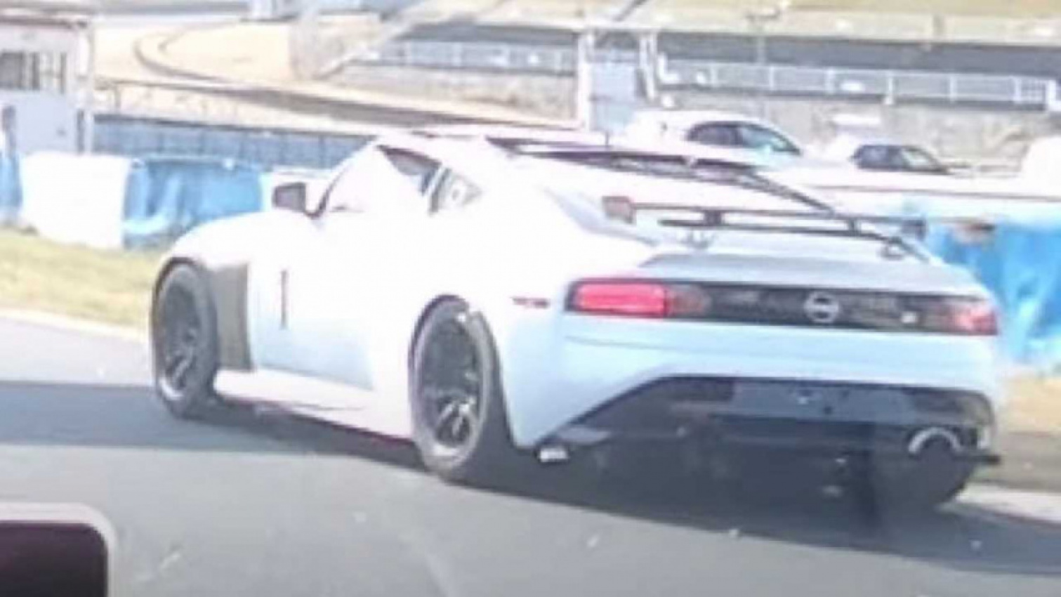 autos, cars, nissan, strange nissan z spotted on track with widebody kit