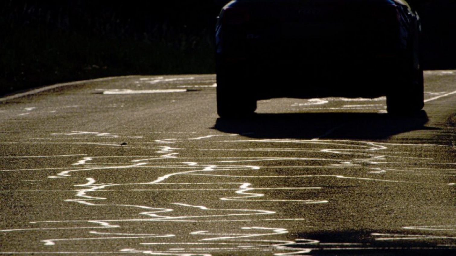 autos, cars, cars, weird car news, what are the weird snake-like black tar lines on roads?
