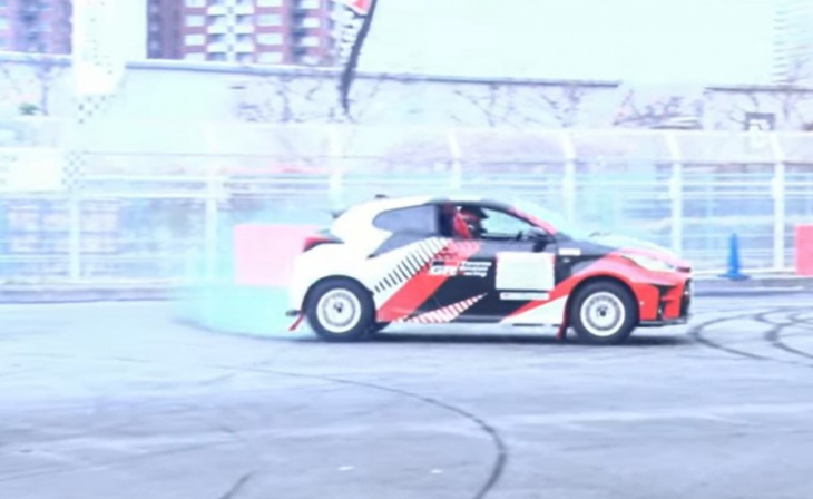 watch: president of toyota waves hands out the window doing donuts in a toyota yaris