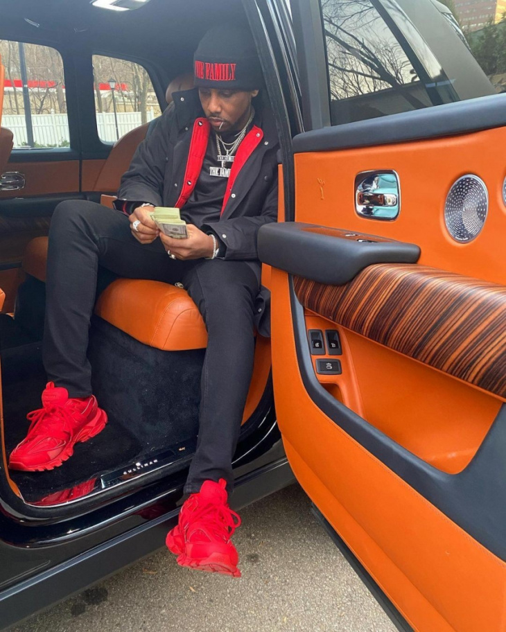 fabolous looks imposing next to his black, fully matte rolls-royce cullinan