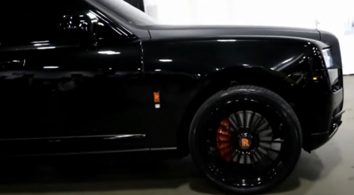 fabolous looks imposing next to his black, fully matte rolls-royce cullinan