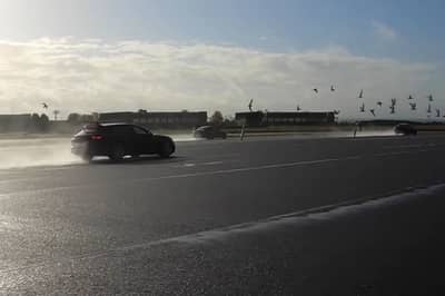 watch a porsche panamera take on a bmw m5 cs, an amg e63, and an audi rs6 in a drag race
