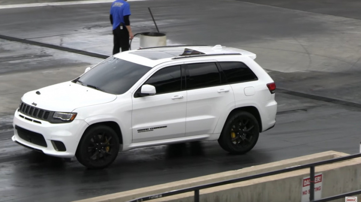 jeep grand cherokee trackhawk may be fast, but can it beat a tesla model 3?