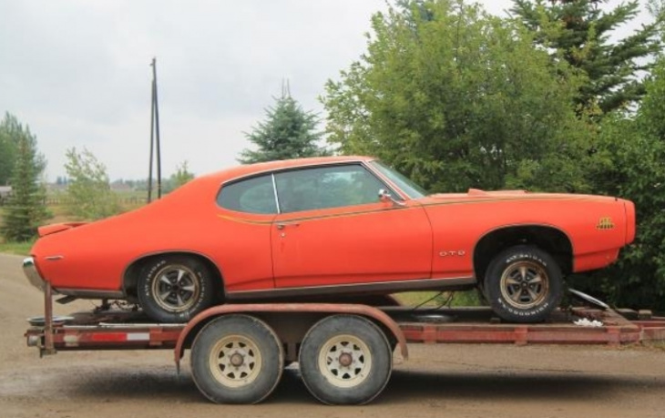 ’69 pontiac gto with a tree growing out of it gets a second chance