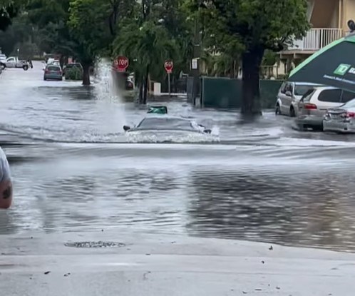 watch: chevrolet c8 corvette swims through flooded street