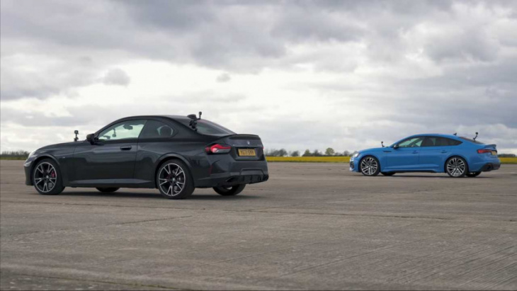 audi rs5 attempts to fend off potent bmw m240i in close drag races