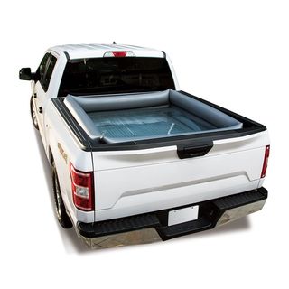 this inflatable pool is designed to fit in back of your truck, so you can cool off wherever you go