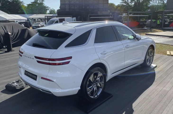 genesis electrified gv70 debuts on stage ahead launch