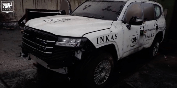 watch an armored toyota land cruiser brush off an explosion