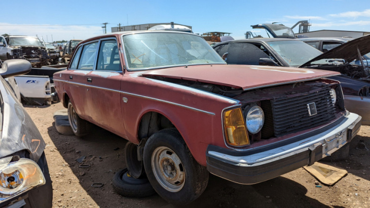 one of the first volvo 240s ever built now resides in a colorado car graveyard