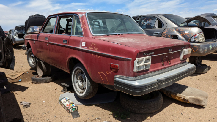 one of the first volvo 240s ever built now resides in a colorado car graveyard