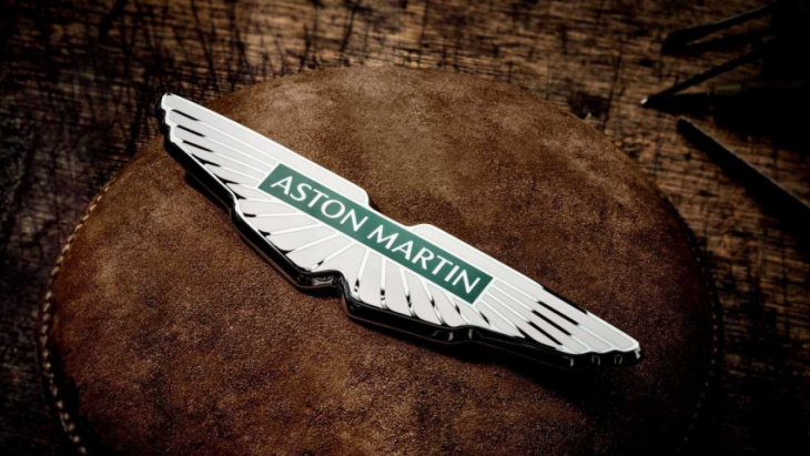 aston martin unveils new brand logo and slogan