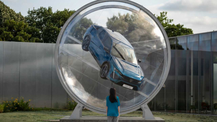 new peugeot 408 encased in a rotating sphere is odd automotive art