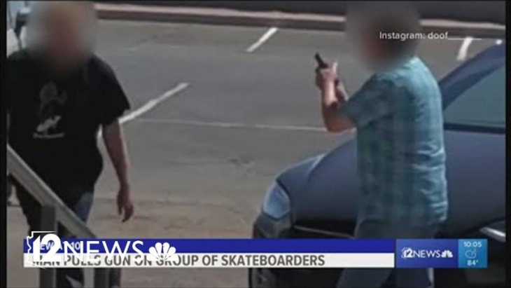 watch tesla model x driver pull gun on skateboarder for no reason