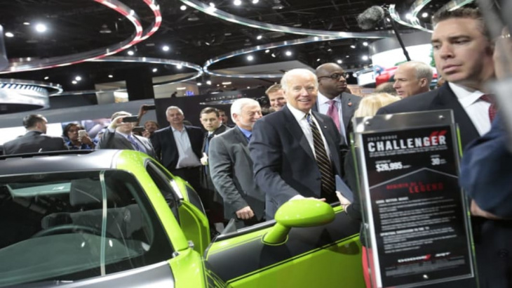 car guy biden tours detroit auto show, announces $900 million for ev chargers