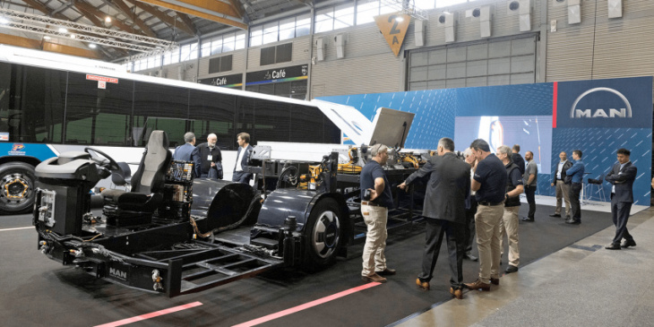 man presents electric bus chassis for global markets
