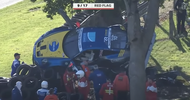 porsche 911 gt3 race car performs fly over at brands hatch, lands in tree