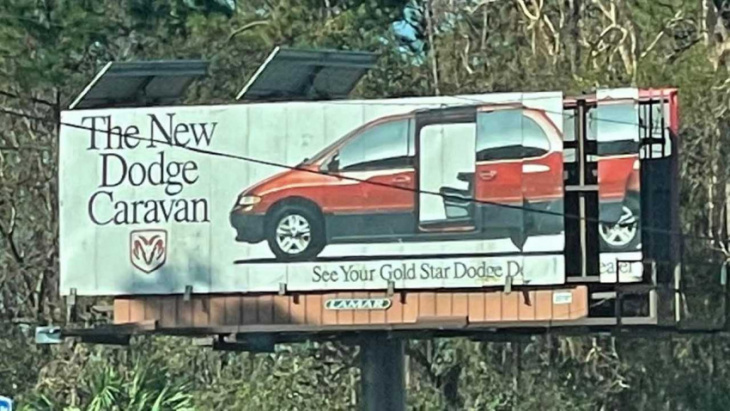 hurricane ian’s high winds reveal 1996 dodge caravan ad on billboard