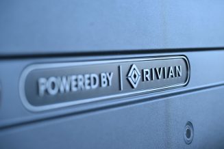 amazon, amazon leans on rivian to deliver packages in 100 u.s. cities for the holidays