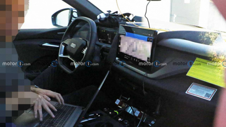 audi q6 e-tron spied with its digital interior largely uncovered