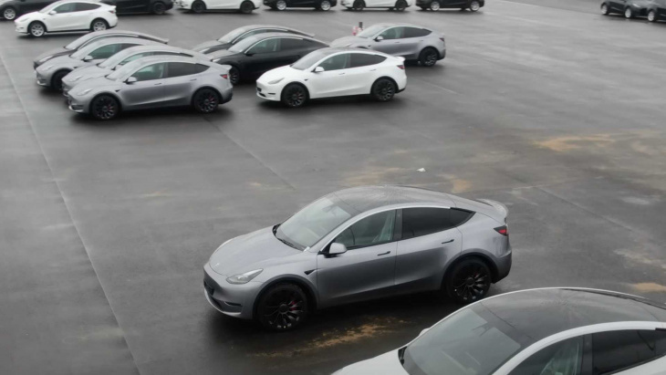 quicksilver tesla model y seen outside berlin gigafactory with white interior