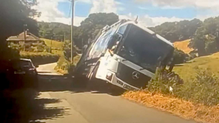 watch massive mercedes garbage truck instantly disappear out of sight