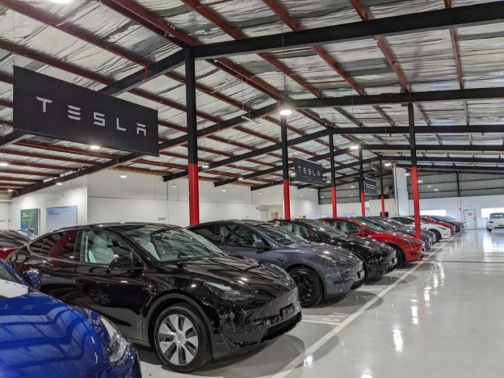 tesla sets sales record but production cut on cards