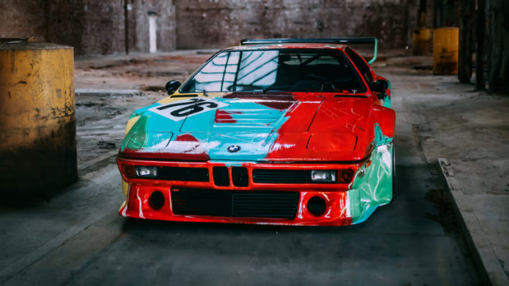 climate activists throw flour on bmw painted by andy warhol