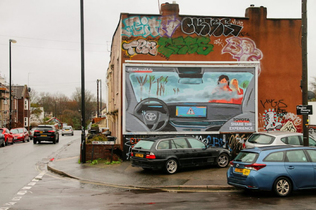 offbeat, industry news, bmw and toyota targeted by european parody billboards tackling polluting suvs