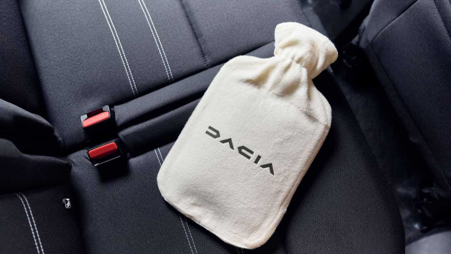 dacia pokes fun at bmw's heated seat subscription with free hot water bottles
