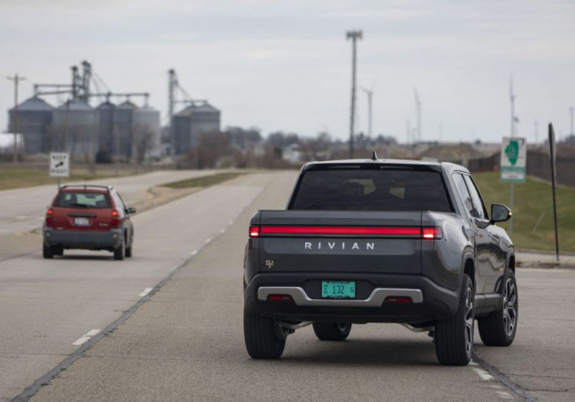 rivian, rivian owner accidentally hits emergency brake on highway looking for windshield wipers