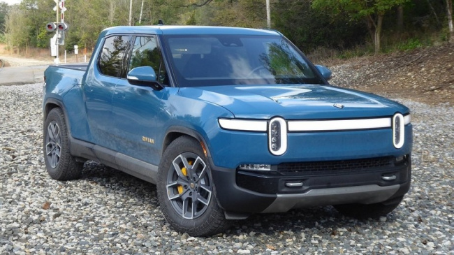 rivian, rivian owner accidentally hits emergency brake on highway looking for windshield wipers
