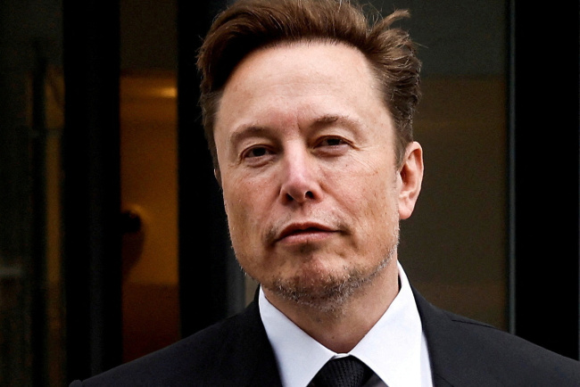 FILE PHOTO: Tesla CEO Musk departs the company’s local office in Washington