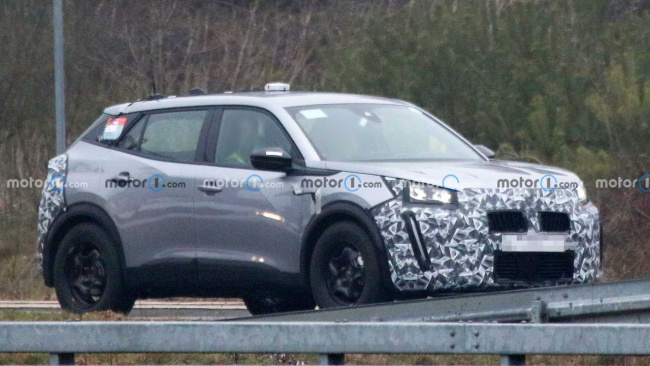 peugeot 2008 crossover hides redesigned face in new spy photos