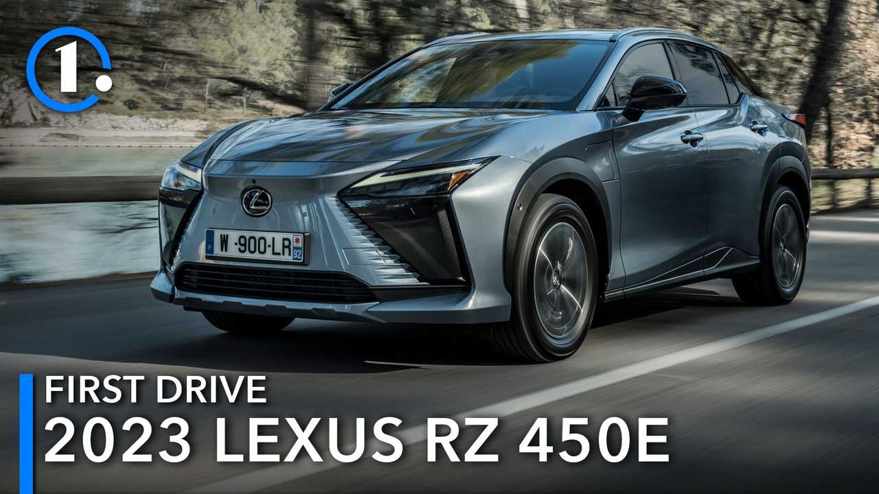 A 2023 Lexus RZ 450e electric vehicle driving down a country road