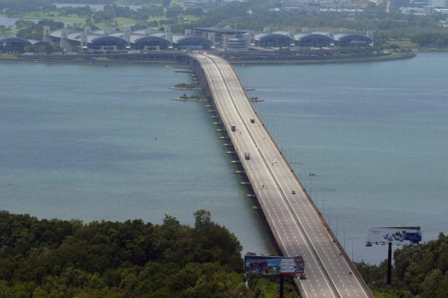 autos news, singapore to match malaysia's revised second link toll rate from march 31